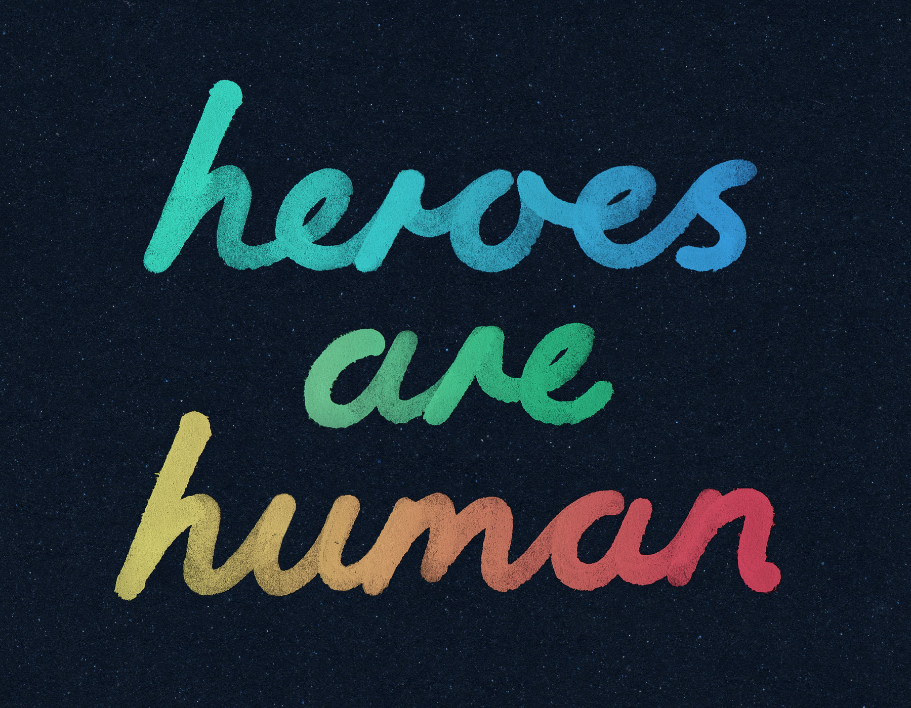 Close-up of heroes are human hand-written cursive type in multicolour ink on navy paper with imperfections