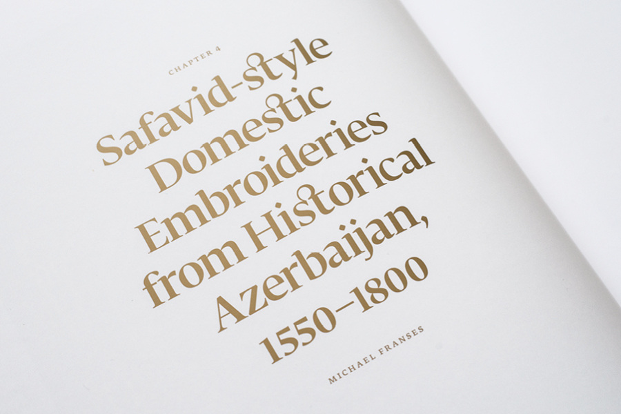 Elegant serif type inspired by Roman inscriptions in gold on white
